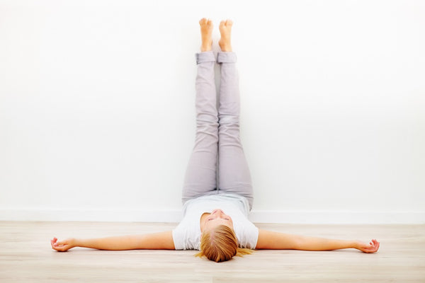 Woman Lying On Mat Doing Half Knees To Chest Pose Stock Photo - Download  Image Now - Yoga, Stretching, Knee - iStock