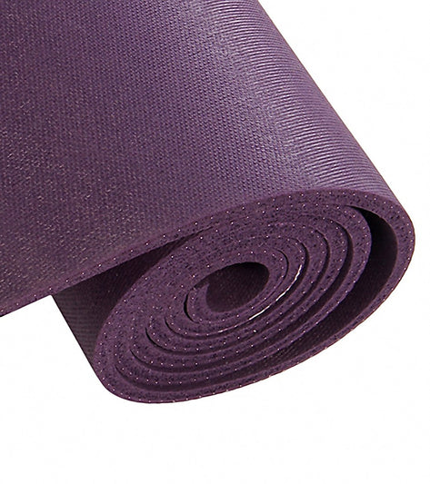 Purple Jade Yoga workout mat rolled up, designed for optimal grip and comfort during yoga sessions. This durable yoga mat is ideal for enhancing stability and support, perfect for both beginners and experienced practitioners.