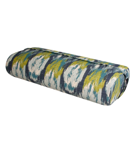 Hugger Mugger's Yoga Bolster in Blue Lagoon features a vibrant, multicolored pattern ideal for enhancing your yoga practice. This supportive bolster is designed to provide comfort and stability during various yoga poses. Perfect for yogis seeking quality and style