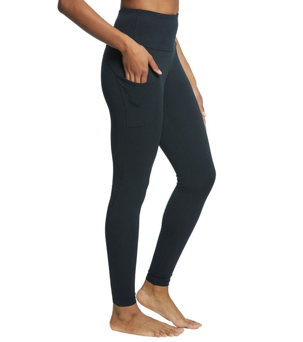 Everyday Yoga Women's Long Yoga Leggings in True Black, designed for optimal comfort and flexibility during yoga sessions. These high-waisted leggings feature a sleek design with convenient side pockets for functionality. Ideal for enhancing your yoga practice with style and ease.