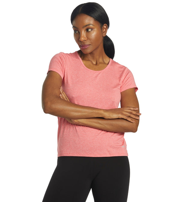 Marika Women's Yoga Short Sleeve Tee in Heather Geranium, designed for yoga enthusiasts. This comfortable and stylish tee features a soft fabric, perfect for flexibility and movement during workouts. Ideal for enhancing your yoga wardrobe with a vibrant color.