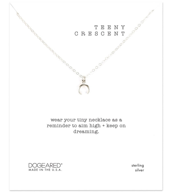 Dogeared Teeny Crescent Necklace in sterling silver, designed for yoga enthusiasts. This delicate silver necklace features a crescent charm, symbolizing aspirations and dreams. Ideal for those seeking a meaningful accessory to complement their yoga practice.