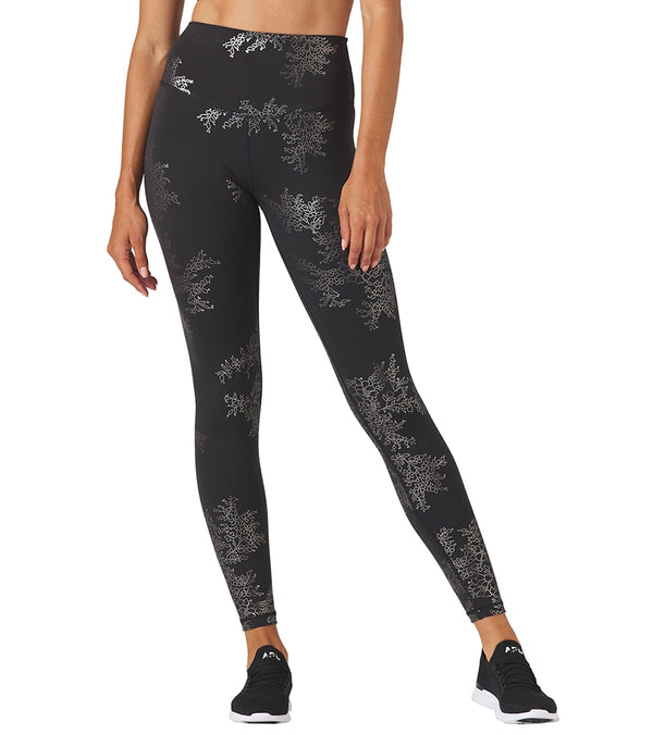 Glyder Women's Long Yoga Leggings in Black with Silver Lace Gloss design. These stylish leggings are perfect for yoga, offering comfort and flexibility. Ideal for enhancing your yoga practice with a touch of elegance.