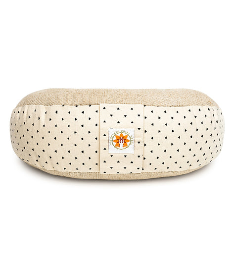 Complete Unity Zafu Meditation Cushion in natural print, ideal for enhancing yoga practice. This cushion features a beige fabric with small black triangle patterns and a Complete Unity Yoga logo. Perfect for meditation and yoga enthusiasts seeking comfort and style.