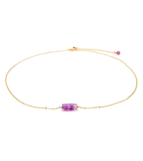 Lotus and Luna Yoga Necklace featuring a delicate gold chain with a central purple gemstone. This elegant necklace is designed for yoga enthusiasts, offering both style and spiritual connection. Perfect for enhancing your yoga practice with a touch of luxury.