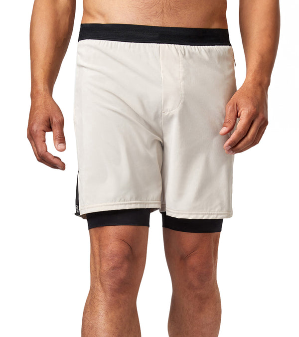 Rhone Men's Yoga Shorts in Tortilla, designed for optimal comfort and flexibility during yoga sessions. These shorts feature a lightweight fabric and a supportive inner layer, ideal for enhancing performance and ease of movement. Perfect for yoga enthusiasts seeking high-quality, stylish active