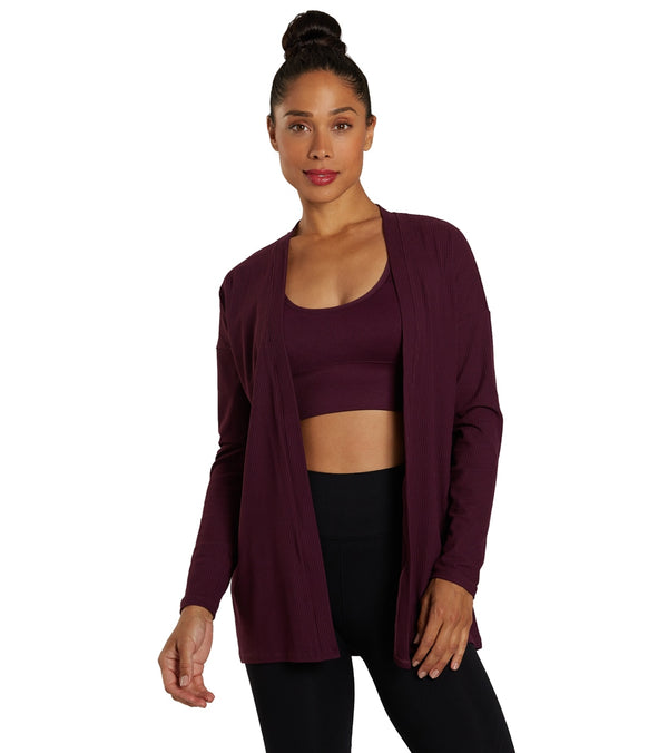 Zobha Women's Yoga Wrap in Potent Purple, designed for comfort and style during yoga sessions. This elegant wrap offers a relaxed fit, perfect for layering over workout attire. Ideal for enhancing your yoga wardrobe with a touch of sophistication.