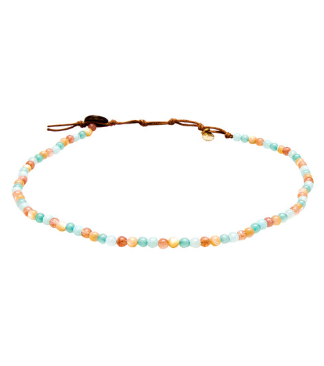 Lotus and Luna Yoga Necklace featuring Quartz and Mother of Pearl beads, designed for yoga enthusiasts. The necklace showcases a blend of pastel-colored beads, perfect for enhancing mindfulness and style during yoga practice. Ideal for those seeking a balance of elegance and spiritual connection