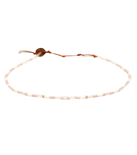 Lotus and Luna Yoga Necklace featuring delicate rose quartz beads, designed for enhancing meditation and yoga practices. This elegant necklace combines natural stones with a minimalist aesthetic, perfect for spiritual and wellness enthusiasts. Ideal for those seeking balance and harmony in their daily routine.