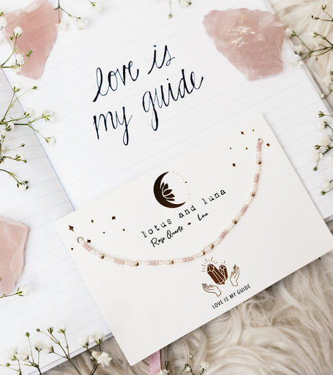 Lotus and Luna Rose Quartz Yoga Necklace displayed on a card with the text 